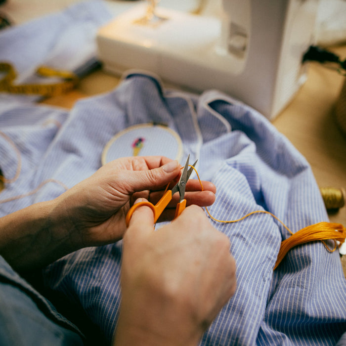 Fiskars Embroidery Scissors cutting thread while person is embroidering