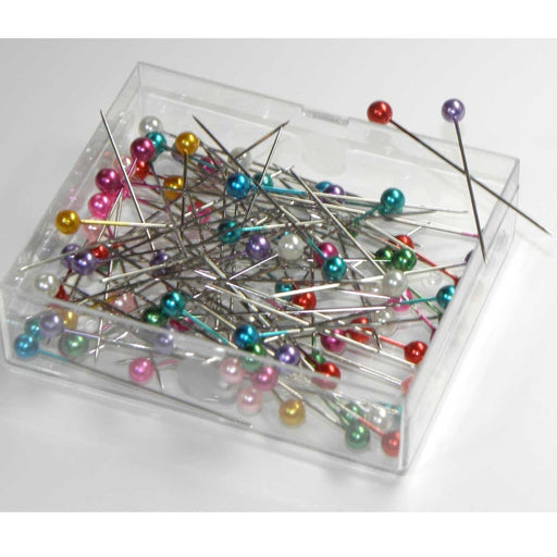 Brightly coloured pins in a practical box